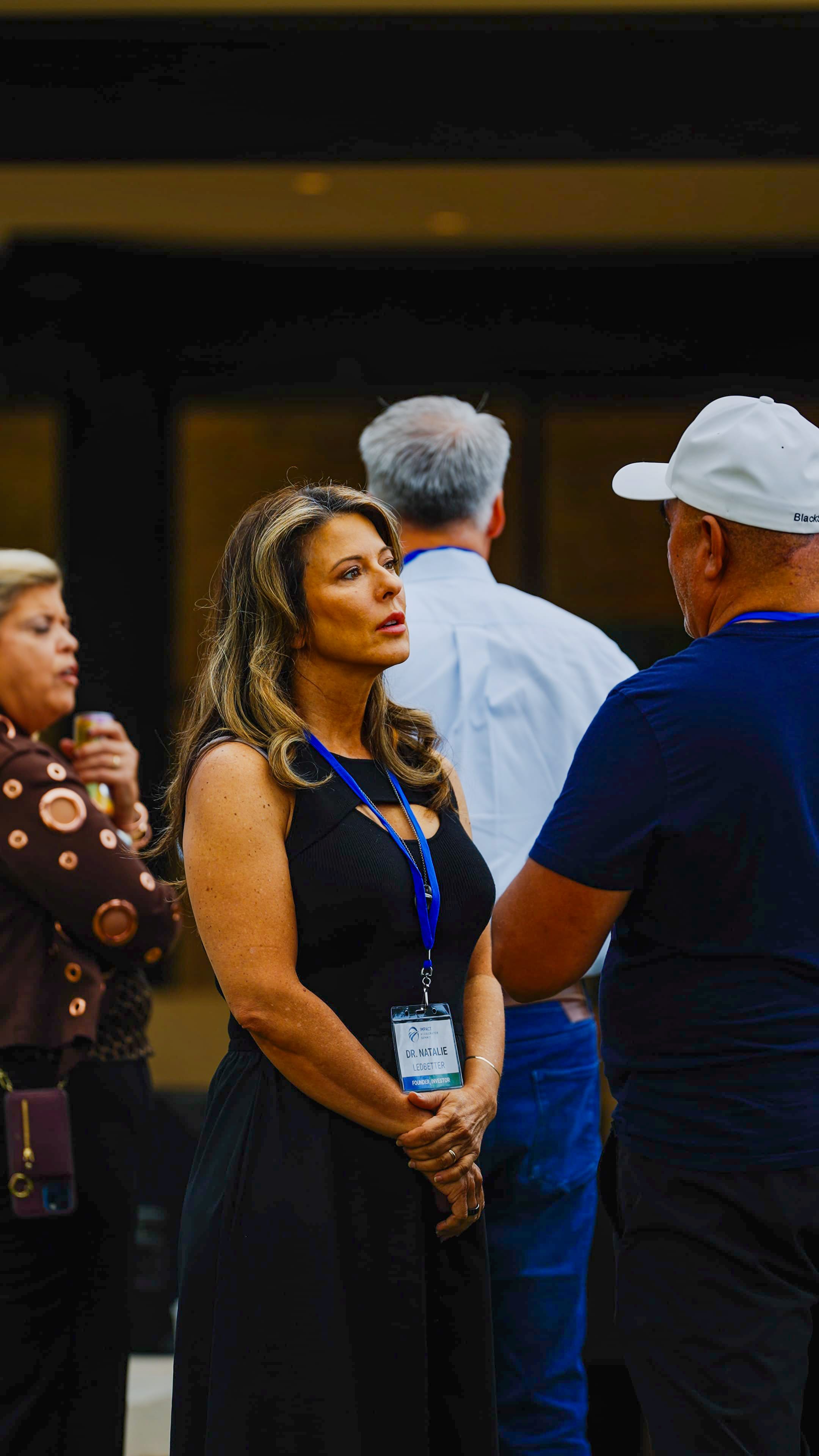 Participants in group conversation indoors