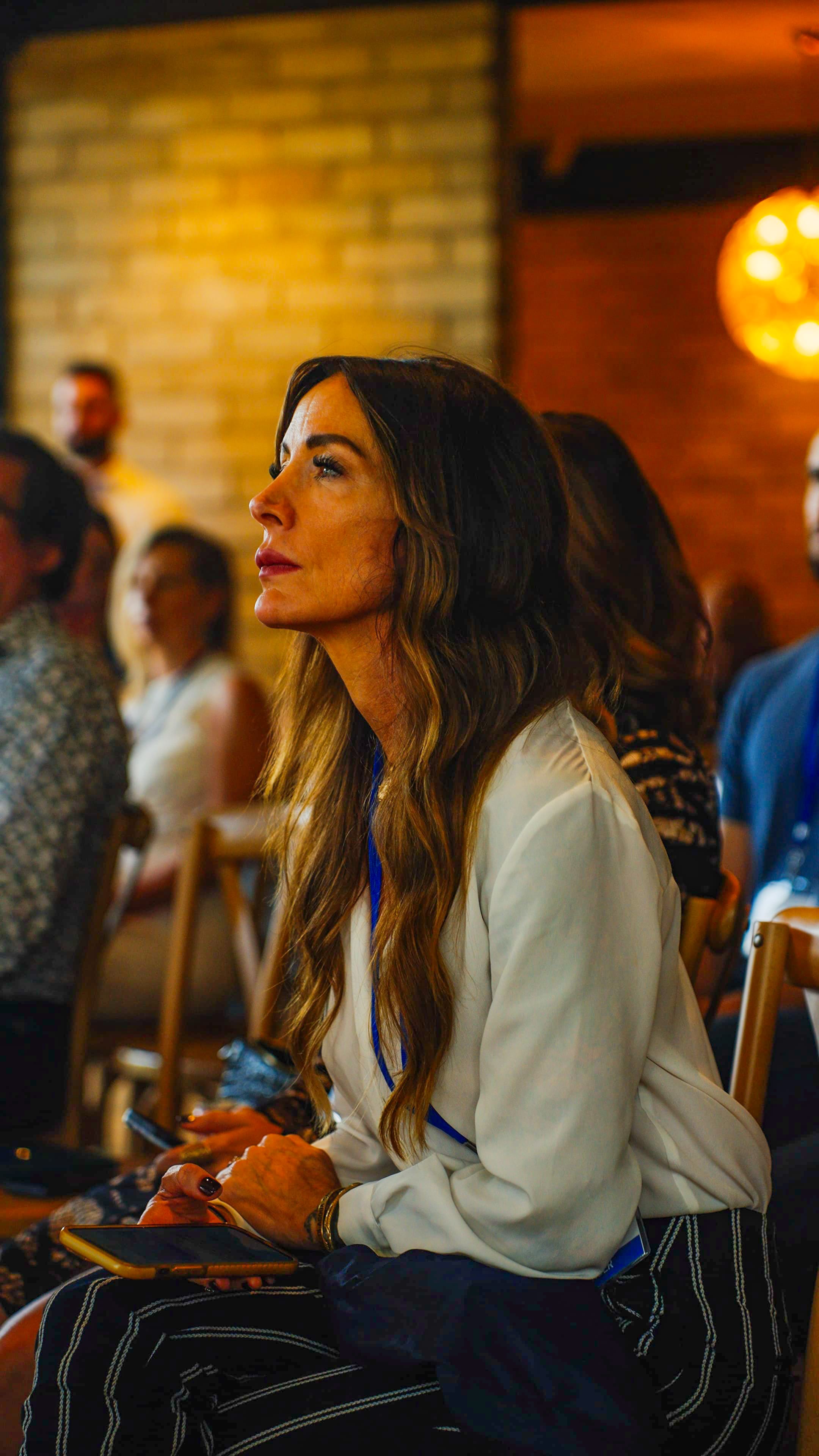 Participants in group conversation at summit