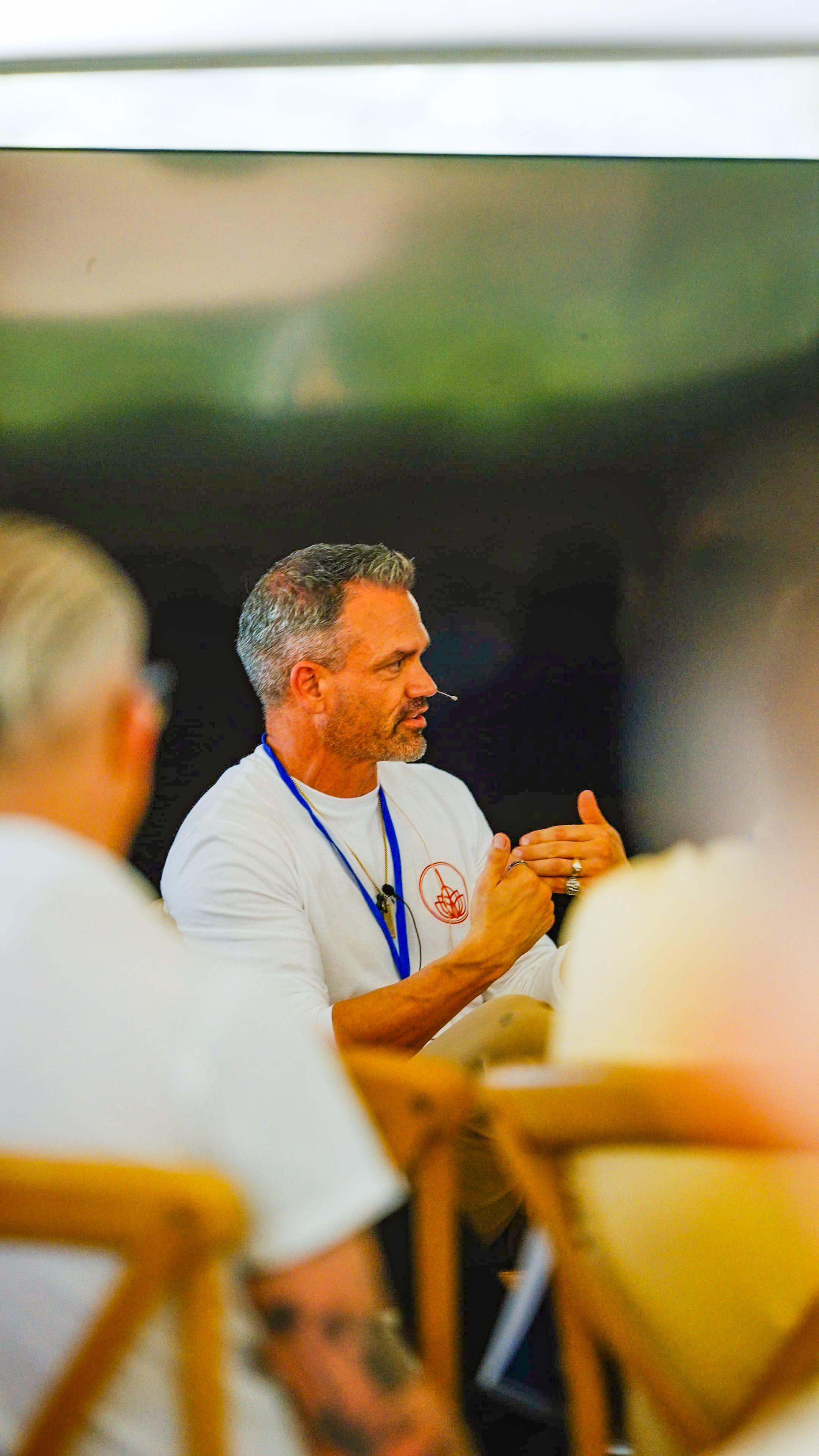 Male participant with microphone headset speaking during session